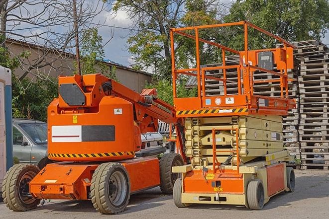 forklift transporting goods in a busy warehouse setting in Foster City, CA